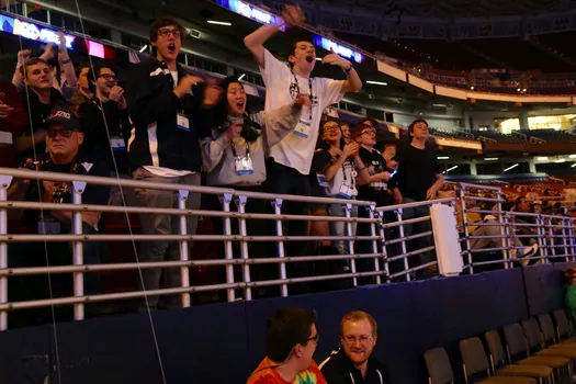 Members of Team 5016 support their team during a match during the FIRST World Championship.