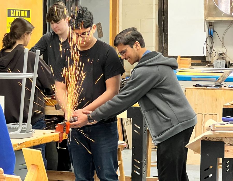 Student using metal grinder